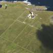 Oblique aerial view of the Muckle Skerry lighthouse, taken from the SE.