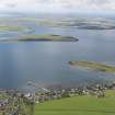 General oblique aerial view of St Mary's looking towards Glimps Holm with Burray and South Ronaldsay beyond, taken from the NNE.