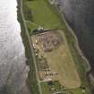 Oblique aerial view of the excavations at the Ness of Brodgar, taken from the NW.