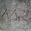 Example of graffiti on the S face of the plinth.