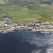 General oblique aerial view of the Dounreay Nuclear Research Facility, taken from the NW.