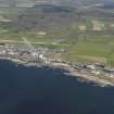 General oblique aerial view of the Dounreay Nuclear Research Facility with the airfield beyond, taken from the NW.