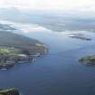 General oblique aerial view looking along the coast towards Tongue Bay and the Kyle of Tongue with Ben Hope beyond, taken from the ENE.