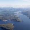 General oblique aerial view looking across Isle Martin towards Ardmair and Ullapool with Loch Broom beyond, taken from the NW.