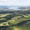 General oblique aerial view looking towards Conon Bridge, Dingwall and the Cromarty Firth, taken from the SW.