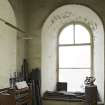 Interior. Belfry room (off gallery), view from N showing arched window