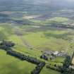 Oblique aerial view of Kirknewton Airfield, looking SE.