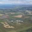 General oblique aerial view with West Freugh Airfield in the foreground and Loch Ryan in the distance, looking NNW.