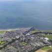 General oblique aerial view of Girvan with Ailsa Craig beyond, looking W.