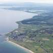 General oblique aerial view of the Sutherland coast with Brora in the foreground and Loch Fleet in the distance, looking NW.
