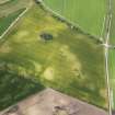 Oblique aerial view of the cropmarks of the pits and field boundary, looking WSW.