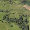Oblique aerial view of Law of Dumbuils fort during excavations by Glasgow University, looking to the N.