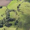Oblique aerial view of Law of Dumbuils fort during excavations by Glasgow University, looking to the W.