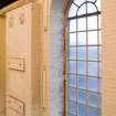 Interior. Main Range (Building 2), deatil of window in south elevation facing onto Russel Colt Street. These wooden framed venetian style windows are original to the building. The glazing has been replaced. The reinfoced brickwork on the left was for plant to be supported.