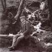 View of 'S R Turnbull lunching at the stream. Fairy Loch. Loch Lomond side, 1904'. 
