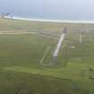 Oblique aerial view of Tiree airfield, looking to the SSE.