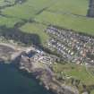 General oblique aerial view of Dunure with the castle in the foreground, taken from the W.