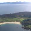 General oblique aerial view of Kiloran Bay looking towards the Paps of Jura, taken from the NW.