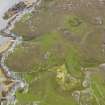 Oblique aerial view of the deserted farmstead at Ardskenish, taken from the NE.