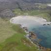 General oblique aerial view of Traigh nam Barc looking across the S end of Colonsay, taken from the W.