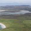 General oblique aerial view of Oronsay Nature Reserve looking towards Colonsay and Mull, taken from the SW.