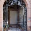 N Front. Entrance porch. Iron gates.  Detail