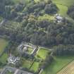 General oblique aerial view of the Dunninald estate, centred on Dunninald Mains Farmhouse,  taken from the ENE.