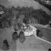 Earlston House, Borgue.  Oblique aerial photograph taken facing north-east.  Prior to its demolition in about 1954.
