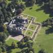 General oblique aerial view of Kinnaird Castle estate, centred on Kinnaird Castle, taken from the NW.