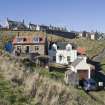 Buildings to W of harbours. View from ENE