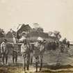 View of woman and child being carried, possibly in India

