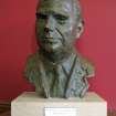 View of bust of Rt. Hon. Iain Macleod, on mantlepiece on E wall of entrance hall.