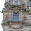 View of female figure and four horses, in broken segmental pediment above second floor, first bay from corner of building.