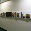 View of 'Narratives' (The Bed Plaque Project'). along wall of N corridor on first floor.