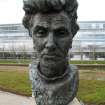 View of herm of W. S. Graham, on loch-side walkway in Edinburgh Park sculpture garden.