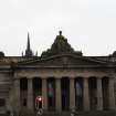 View of statue of Queen Victoria and sphinxes, on roof of Royal Scottish Academy.