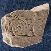 View of cross-slab fragment, Drainie no 24, with spiral decoration. 
