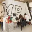 View of students working within the studio space of the visual communications department of the Foulis Building