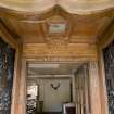 View of carved architrave of internal main entrance door and double leaf external doors