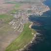General oblique aerial view of Anstruther Golf Course and the village of Anstruther in the background, taken from WSW.