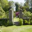 Walled garden.  Gates on south wall from north with footbridge beyond.