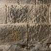 Detail of possible carved stones built into wall in basement of church