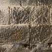 Detail of possible carved stones built into wall in basement of church  (with scale)