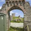 Decorative arch, view from W with tower on site of broch beyond