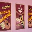 Interior view of North Star Cinema, Lerwick. Ground floor, foyer, detail of 'Disco' posters on wall