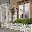 View from NNE of decorative ironwork porch and railings at 1-5 Marine Court, Argyle Street, Rothesay, Bute