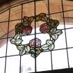 Interior. Ground floor. Detail of stained glass above entrance doorway.