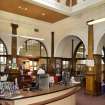 Interior. Ground floor. General view showing issue desk and partition walls.