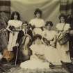Photograph showing the Mather family with instruments
