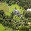 Oblique aerial view of Knocknalling House and policies, taken from the NW.